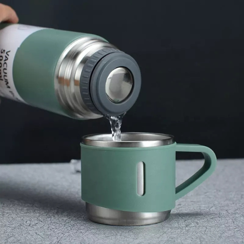 A set of one and two mugs made of stainless steel with a silicone handle
