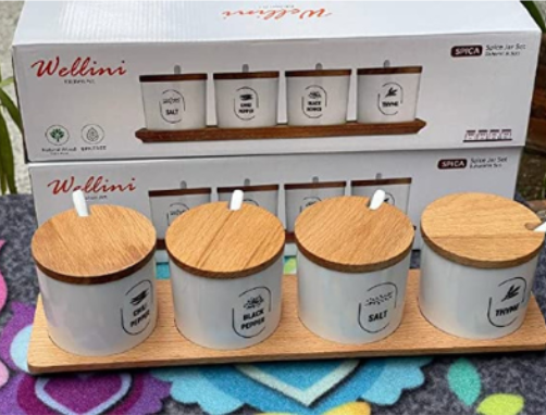 Spices set with spoons and natural wood stand