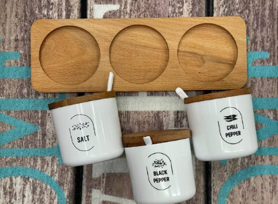 Spices set with spoons and natural wood stand