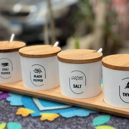 Spices set with spoons and natural wood stand