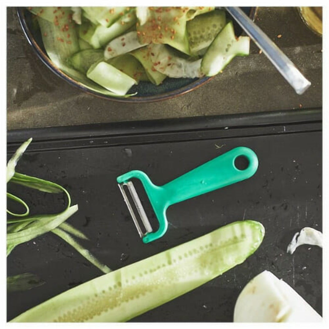 Bright Green Vegetable Peeler with an Ergonomic Grip Handle