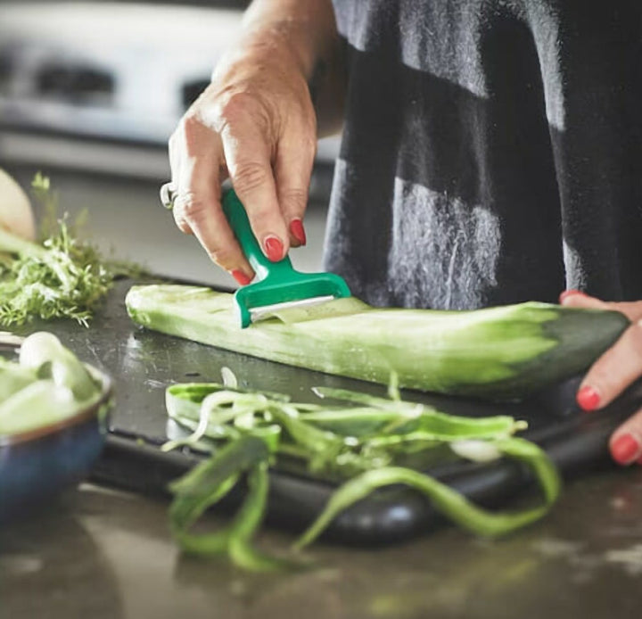 Bright Green Vegetable Peeler with an Ergonomic Grip Handle